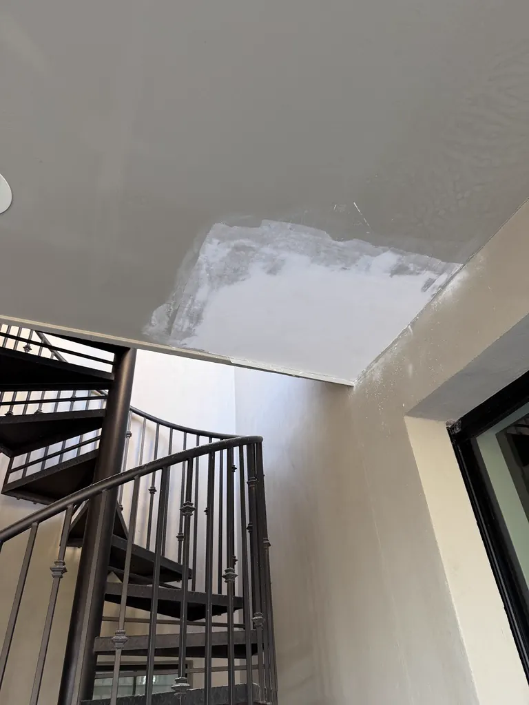 Ceiling drywall repair after an upstairs plumbing leak